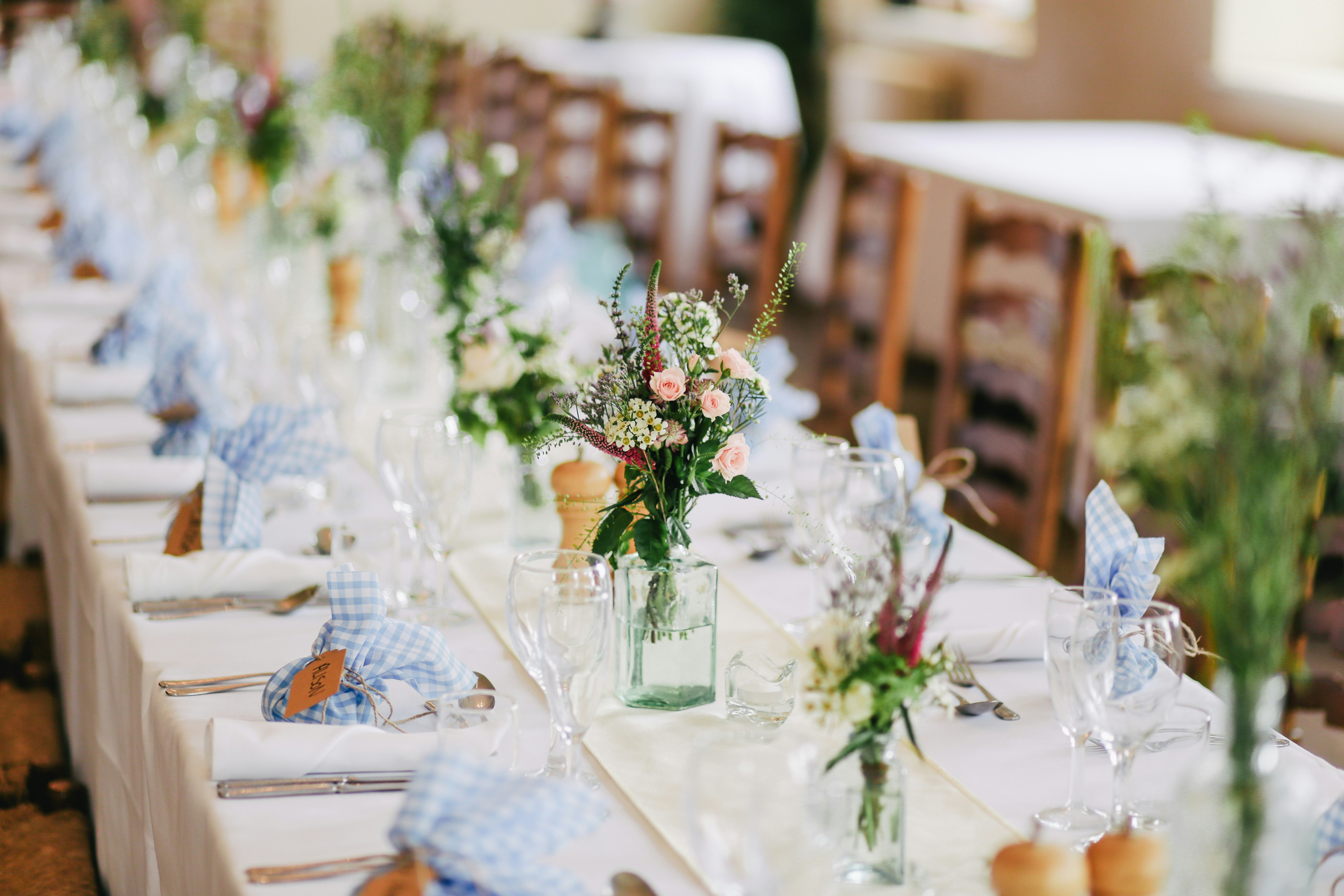 A gride and groom at wedding with a bouquet of flowers